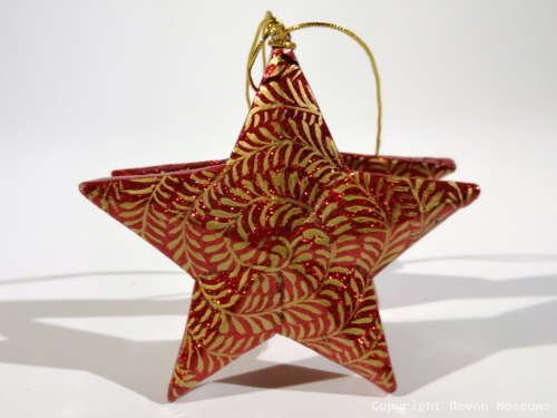 Red swirl star decoration product photo